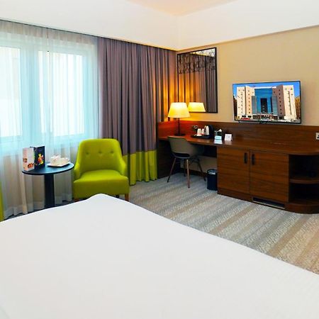 The Grand Lux Hotel Dauhá Exteriér fotografie A room at the hotel