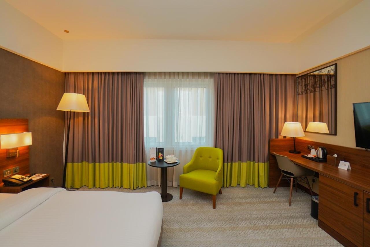 The Grand Lux Hotel Dauhá Exteriér fotografie A room at the hotel