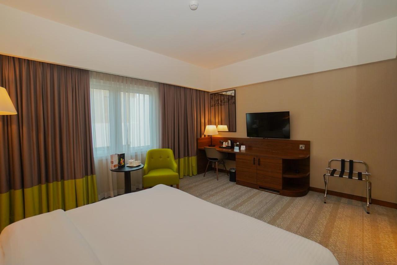 The Grand Lux Hotel Dauhá Exteriér fotografie A room at the hotel