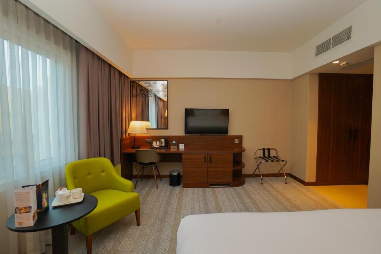 The Grand Lux Hotel Dauhá Exteriér fotografie A room at the hotel