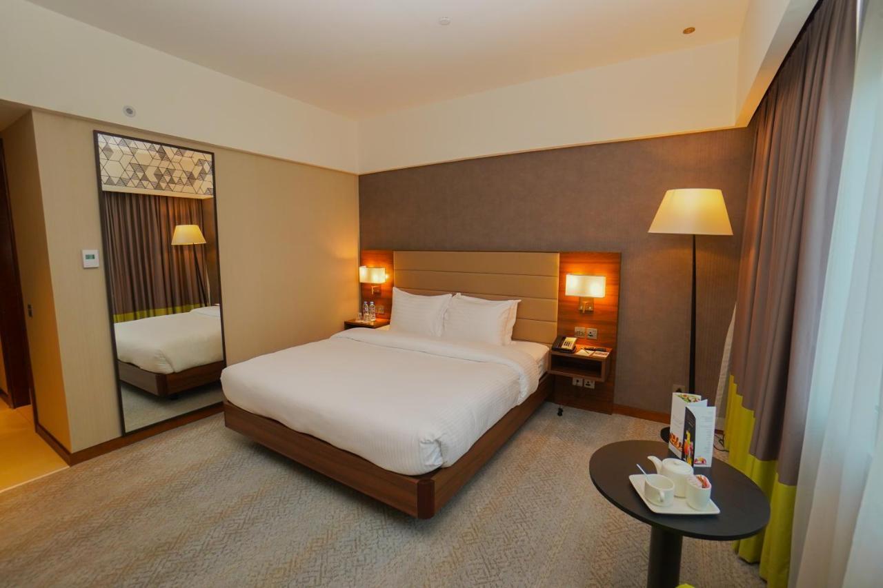 The Grand Lux Hotel Dauhá Exteriér fotografie A room at the hotel