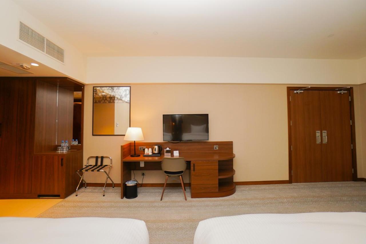 The Grand Lux Hotel Dauhá Exteriér fotografie A room at the hotel