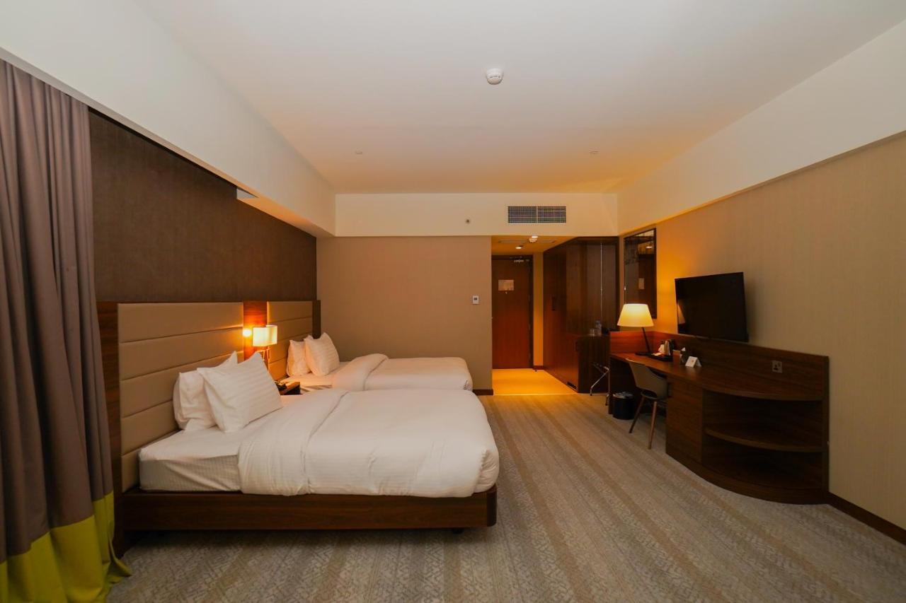 The Grand Lux Hotel Dauhá Exteriér fotografie Deluxe room