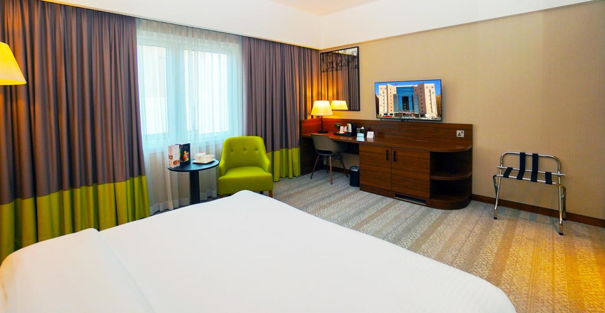 The Grand Lux Hotel Dauhá Exteriér fotografie A room at the hotel
