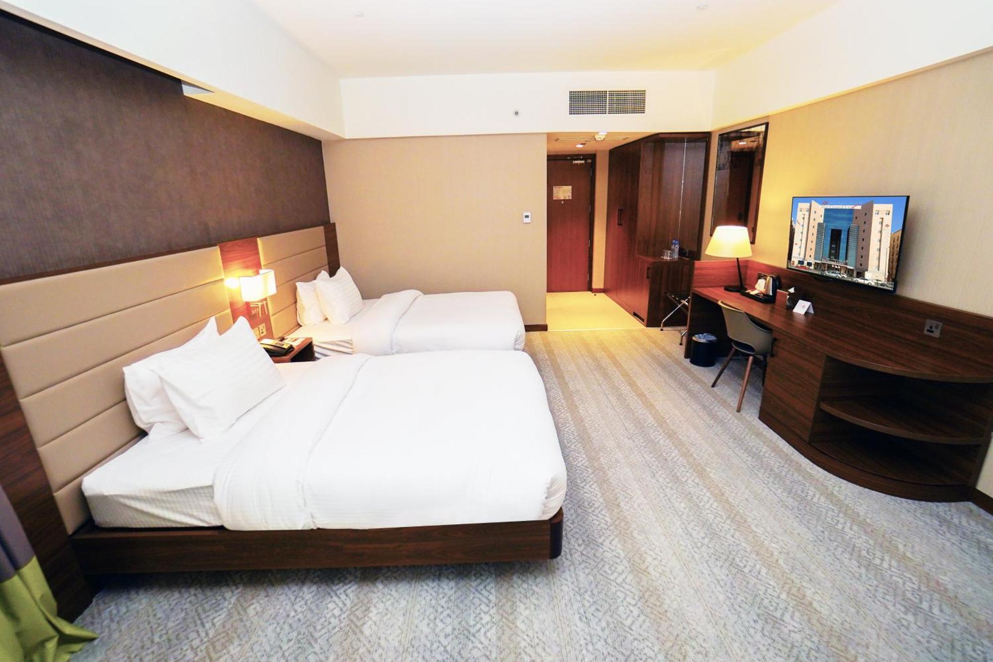The Grand Lux Hotel Dauhá Exteriér fotografie Deluxe Room